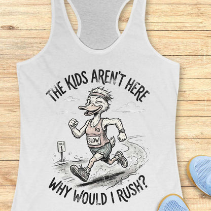 white tank top with a cartoon character and text - the kids aren't here, why would I rush?,  on a wooden surface