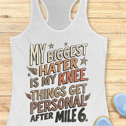 white tank top with motivational text on a wooden surface