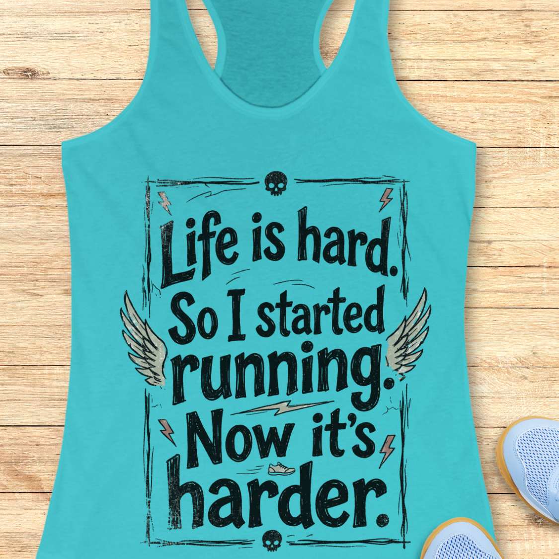 Turquoise tank top with a text - life is hard. So I started running. Now it's harder on a wooden surface