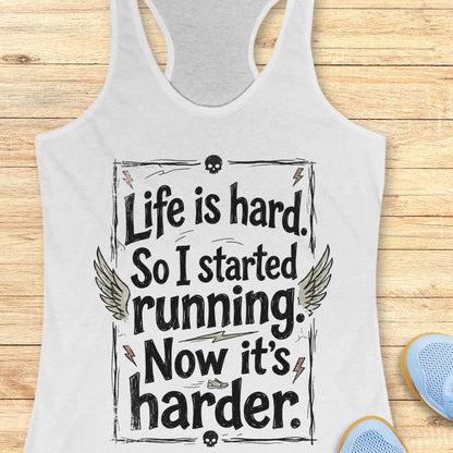 white tank top with a text - life is hard. So I started running. Now it's harder on a wooden surface