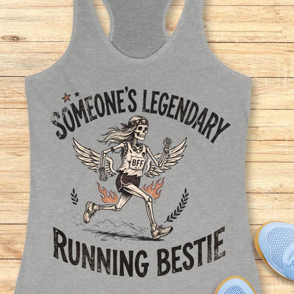 Gray tank top with skeleton design and text someone's legendary running bestie on a wooden surface