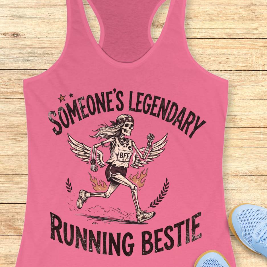 Pink tank top with skeleton design and text someone's legendary running bestie on a wooden surface