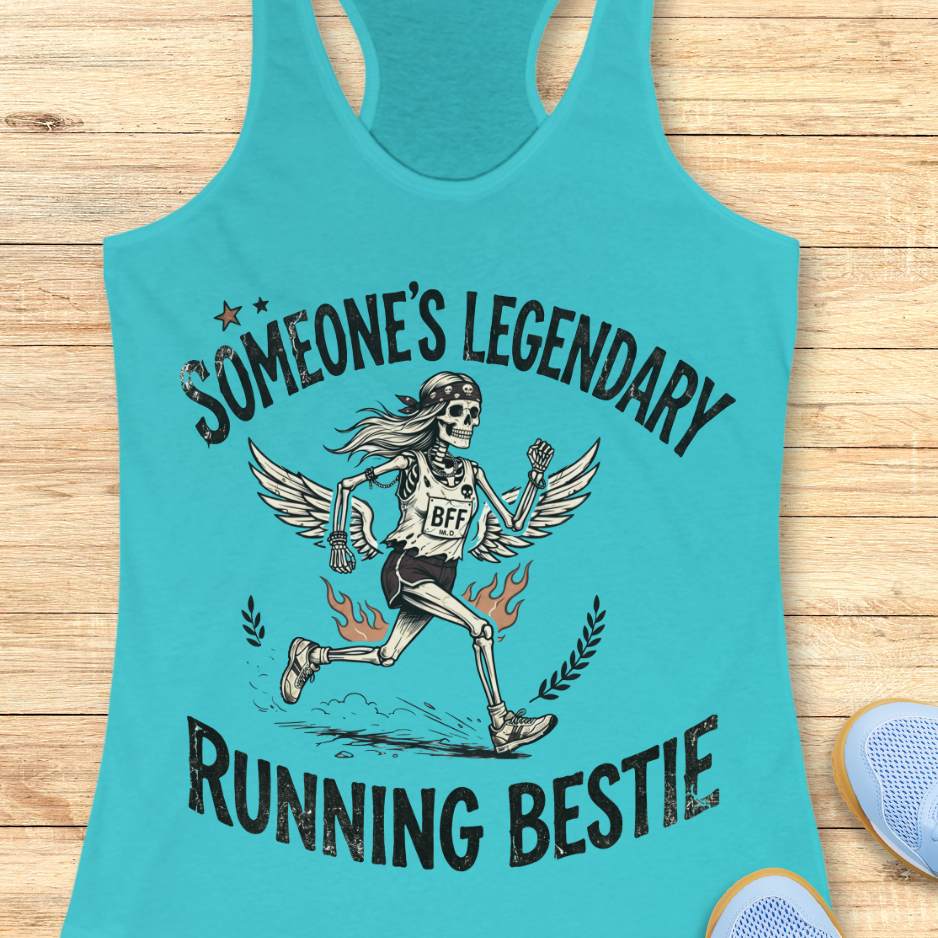 Turquoise tank top with skeleton graphic and text someone's legendary running bestie on a wooden surface