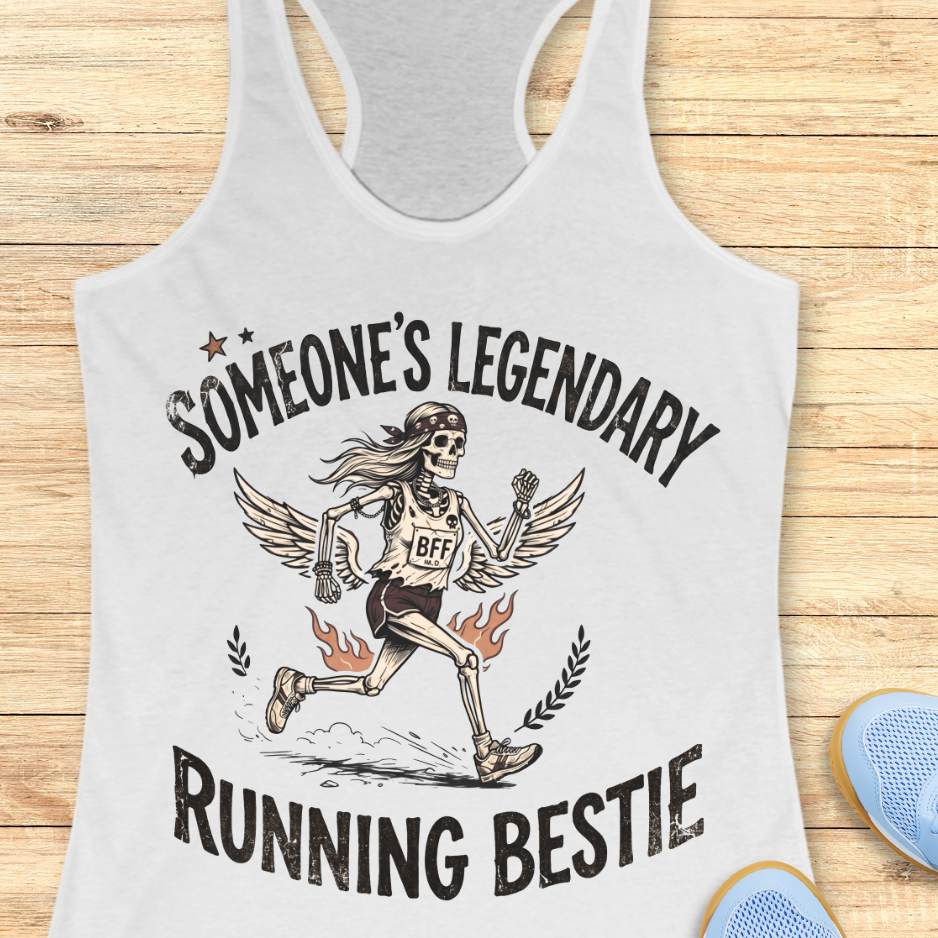 white tank top with skeleton design and text someone's legendary running bestie on a wooden surface