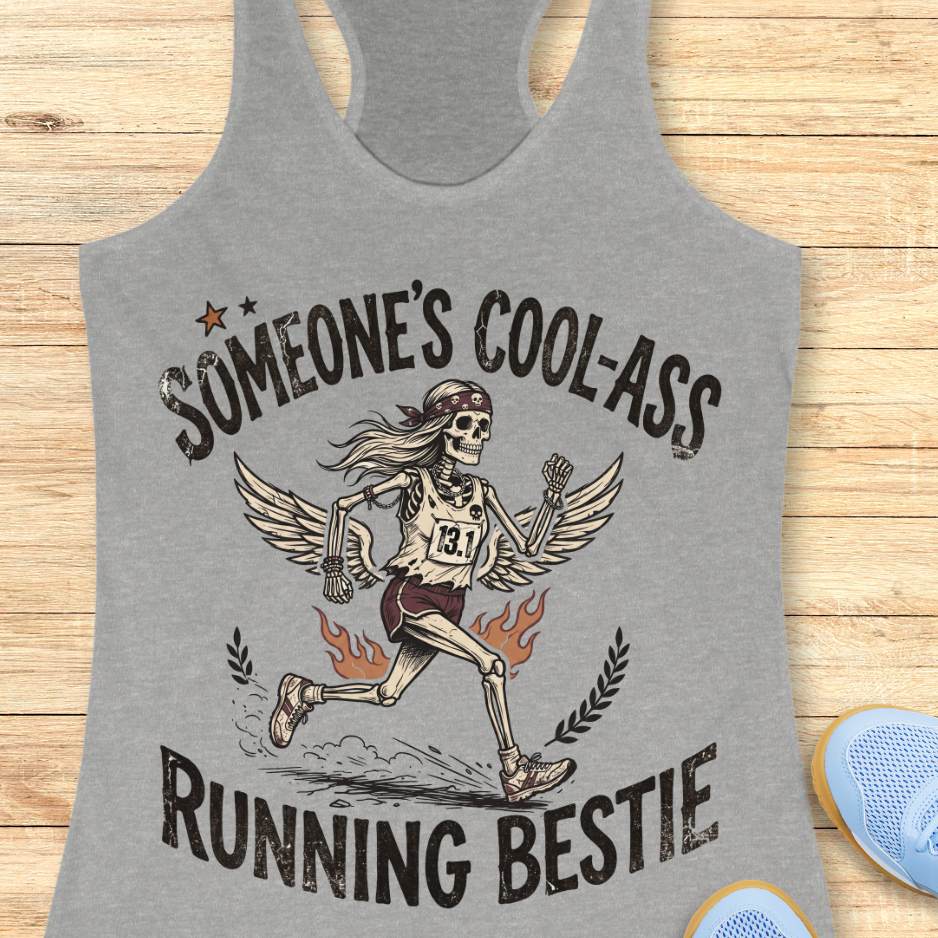 Gray tank top with skeleton runner graphic and text someone's cool-ass running bestie on a wooden surface