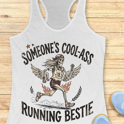 white tank top with skeleton design and text someone's cool-ass running bestie on a wooden surface