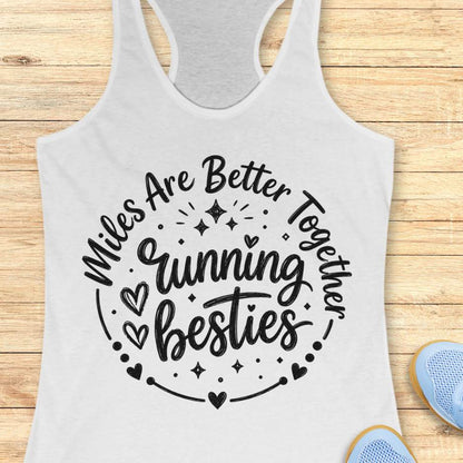 Gray tank top with 'Miles Are Better Running Together Besties' text on a wooden surface.