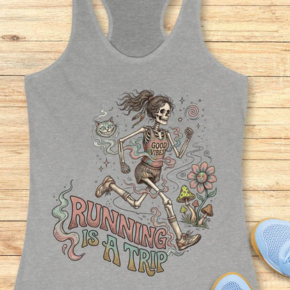 Gray tank top with skeleton design and 'Running is a Trip' text on a wooden surface