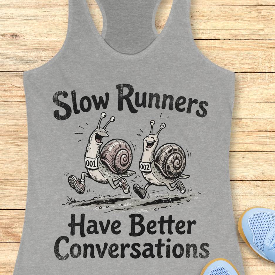 Gray tank top with snail design and text 'Slow Runners Have Better Conversations' on a wooden surface.
