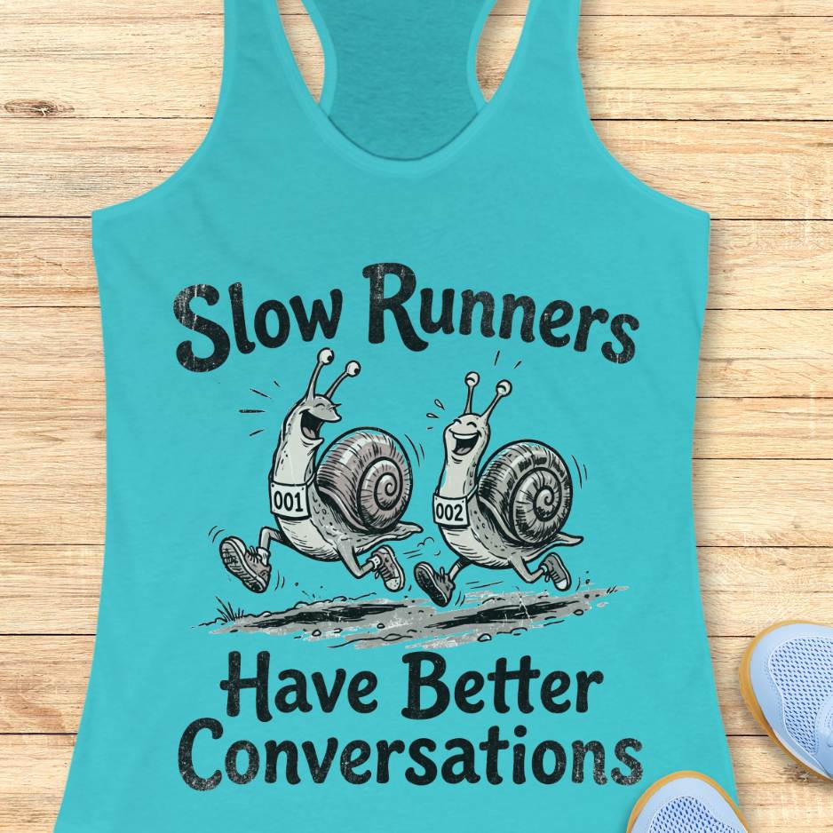 Turquoise tank top with snail graphic and text 'Slow Runners Have Better Conversations' on a wooden surface.