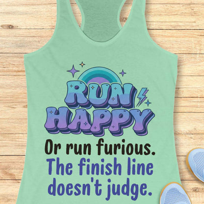 Green tank top with motivational text  "RUN HAPPY OR RUN FURIOUS. THE FINISH LINE DOESN'T JUDGE. " on a wooden surface