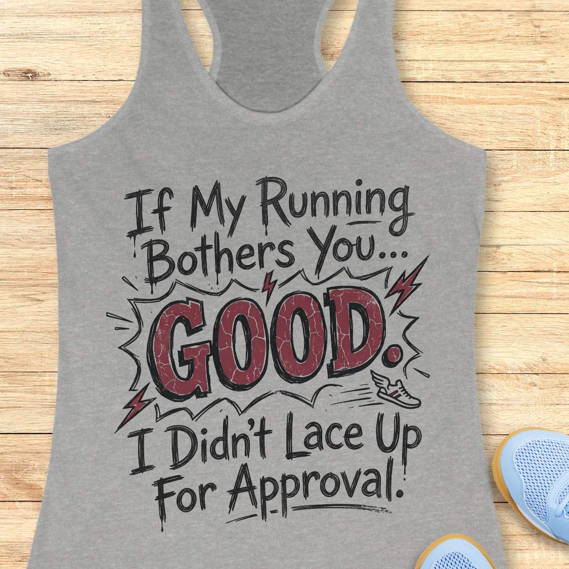 Gray tank top with humorous text If my running bothers you...good. I didn't lace up for approval. on on a wooden surface