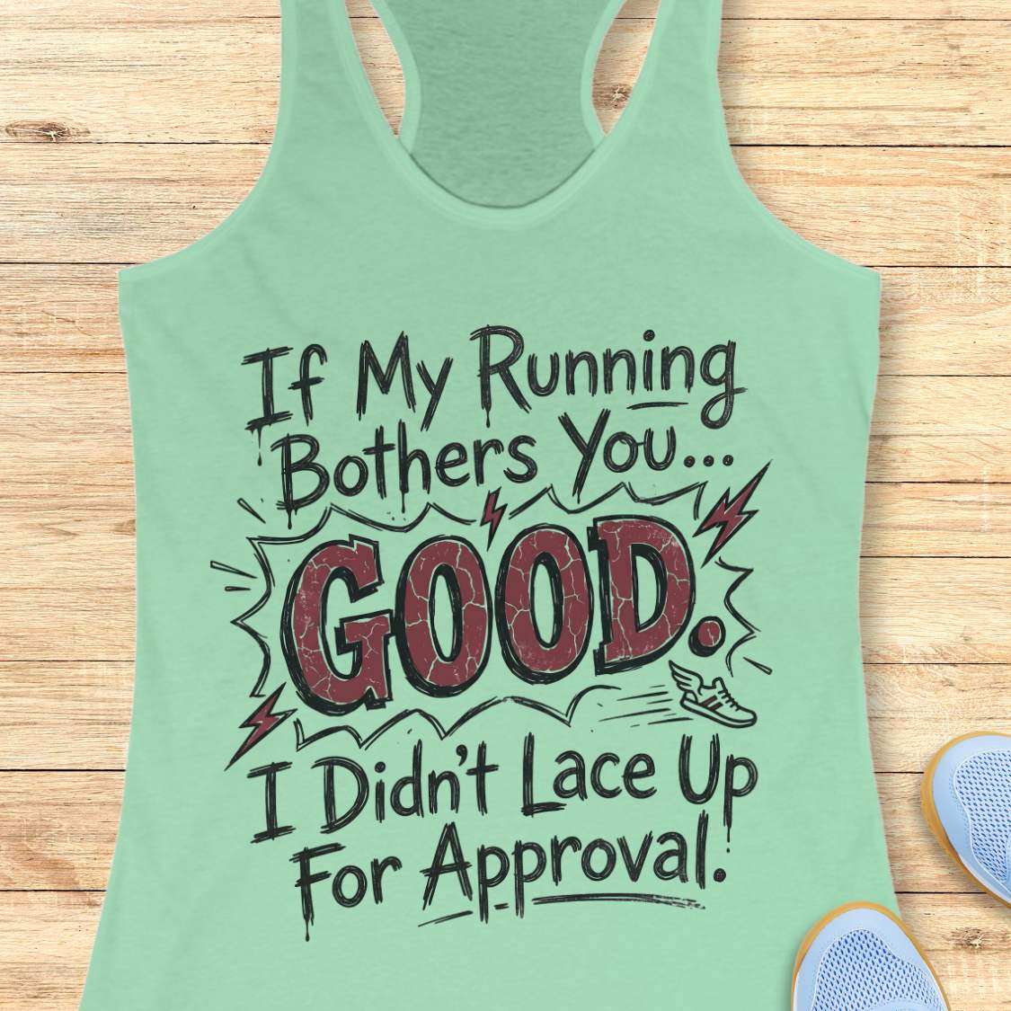 Light green tank top with humorous text If my running bothers you...good. I didn't lace up for approval.  on a wooden surface