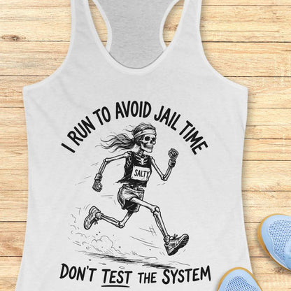 white tank top with skeleton design and text i run to avoid jail time don't test the system  on a wooden surface