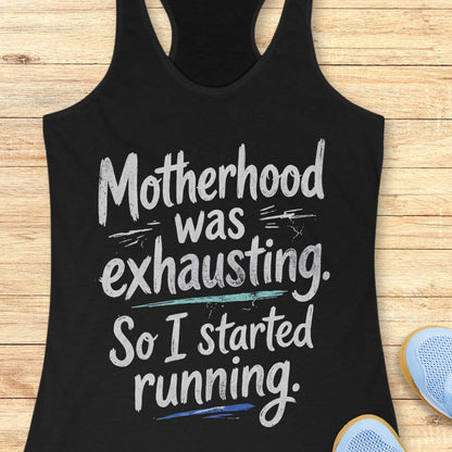 Black tank top with humorous text motherhood was exhausting. So I started running.  on a wooden surface