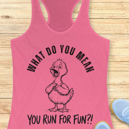 Pink tank top with a cartoon duck and text what do you mean you run for fun, on a wooden surface