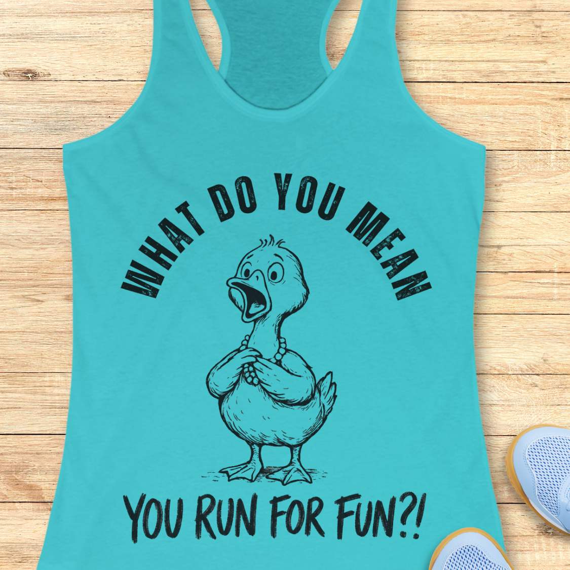 Turquoise tank top with a graphic of a duck and text what do you mean you run for fun, on a wooden surface