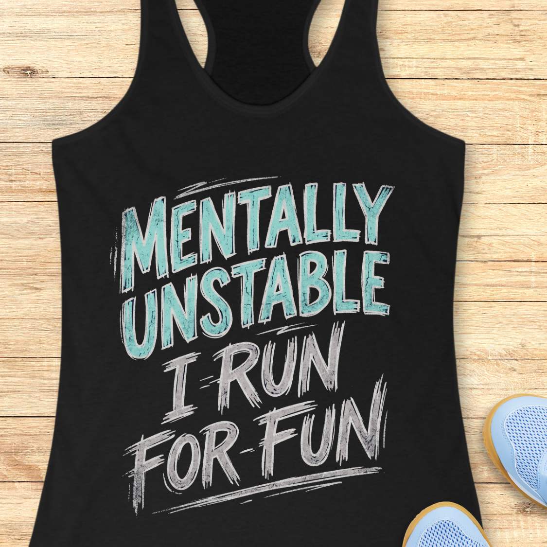 Black tank top with funny text - mentally unstable, I run for fun, on a wooden surface