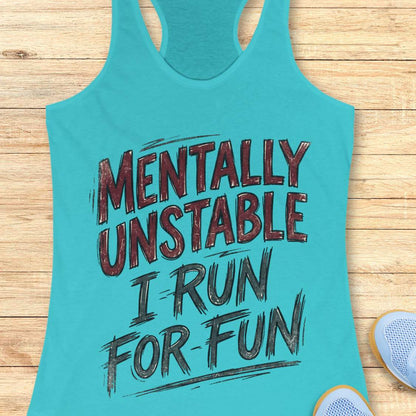 Turquoise tank top with text 'Mentally Unstable I Run For Fun' on a wooden surface.
