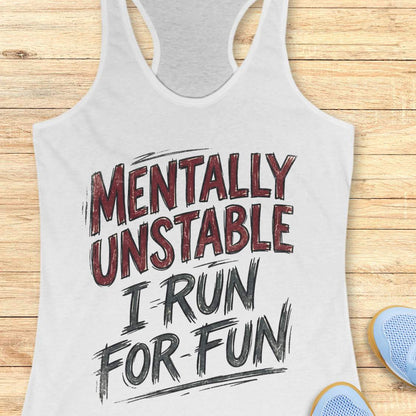 white tank top with 'Mentally Unstable I Run For Fun' text on a wooden surface.