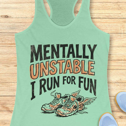 Mint green tank top with 'Mentally Unstable I Run For Fun' text and shoe graphic on a wooden surface.