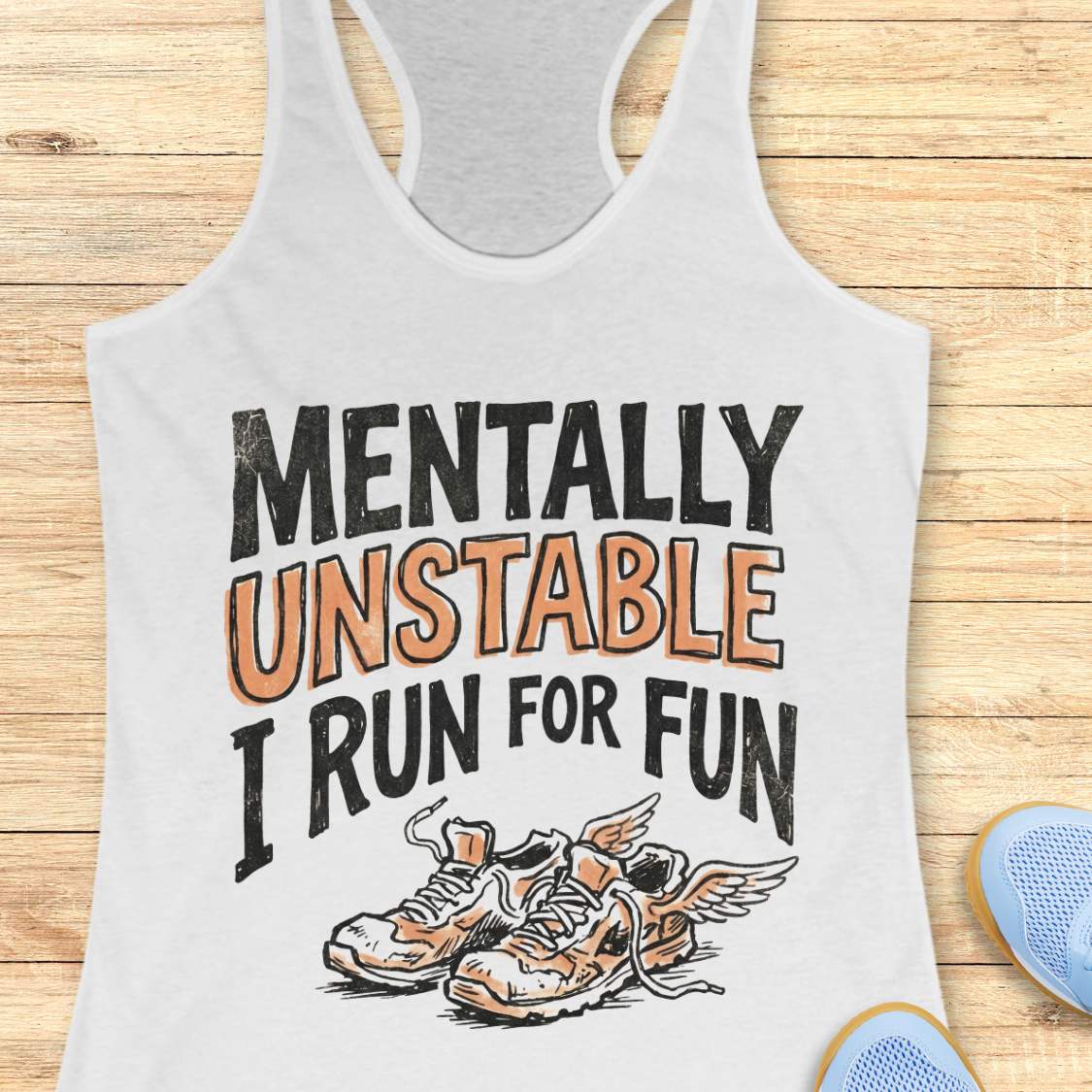 white tank top with 'Mentally Unstable I Run For Fun' text and shoe graphic on a wooden surface.