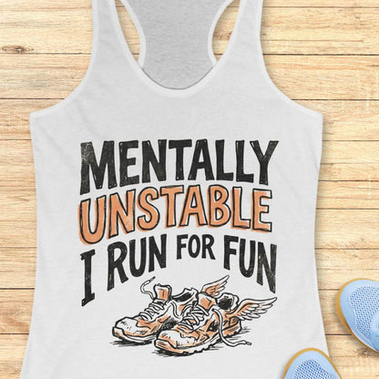 white tank top with 'Mentally Unstable I Run For Fun' text and shoe graphic on a wooden surface.