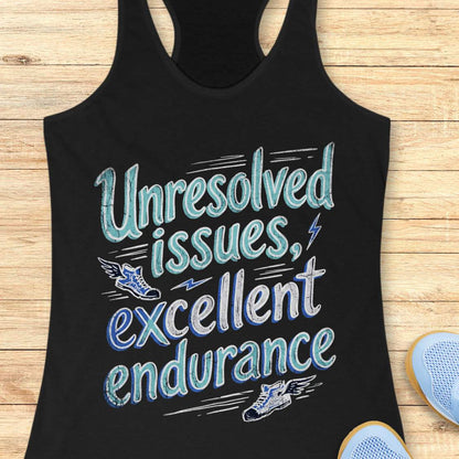 Black tank top with  text 'Unresolved issues, excellent endurance' on a wooden surface