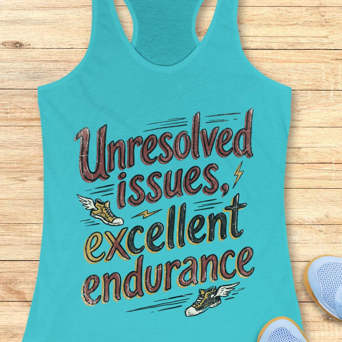 Turquoise tank top with humorous text 'Unresolved issues, excellent endurance' on a wooden surface