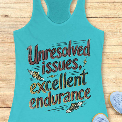 Turquoise tank top with humorous text 'Unresolved issues, excellent endurance' on a wooden surface