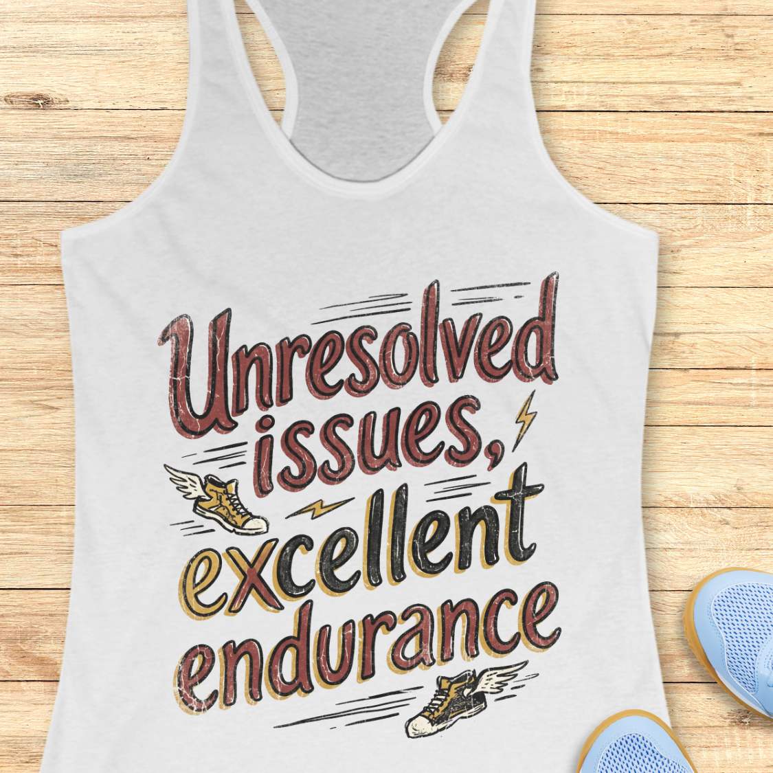 white tank top with humorous text 'Unresolved issues, excellent endurance' design on a wooden surface