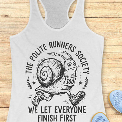 white tank top with 'The Polite Runners Society' graphic on a wooden surface