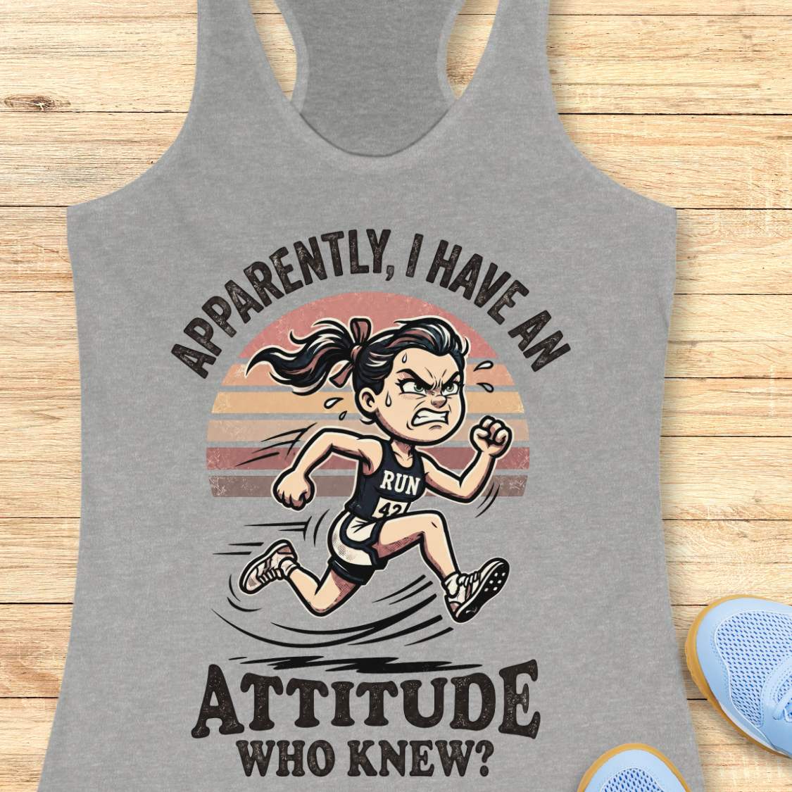 Gray tank top with a graphic of a running person and text on a wooden surface
