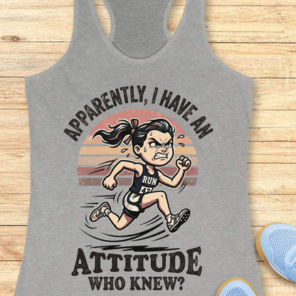 Gray tank top with a graphic of a running person and text on a wooden surface