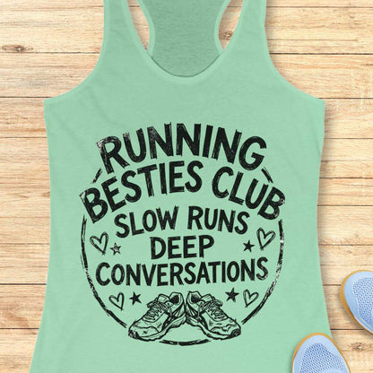 Mint green tank top with 'Running Besties Club' text on a wooden surface
