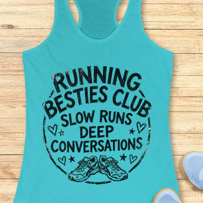 Turquoise tank top with a graphic and text Running besties club, slow runs, deep conversations, on a wooden surface