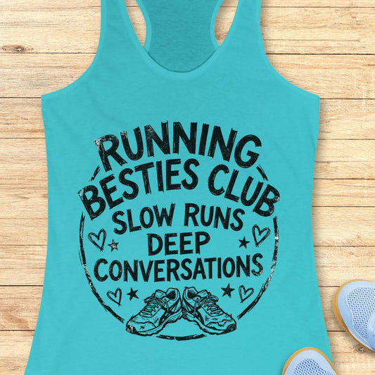 Turquoise tank top with a graphic and text Running besties club, slow runs, deep conversations, on a wooden surface