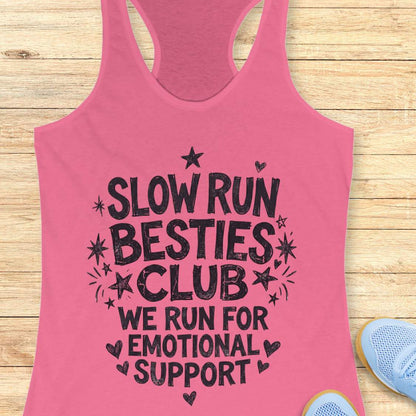 pink tank top with 'Slow Run Besties Club' text on a wooden surface