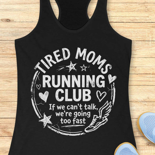 Black tank top with 'Tired Moms Running Club' text on a wooden surface