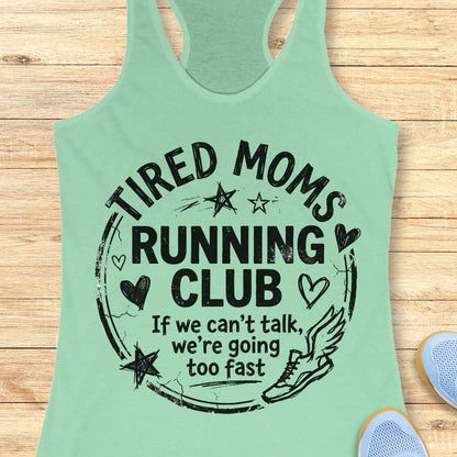 Mint green tank top with 'Tired Moms Running Club' text on a wooden surface