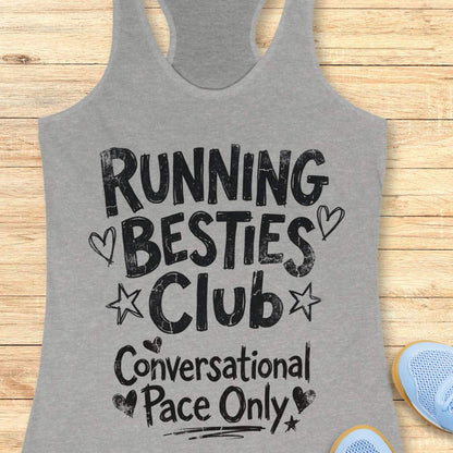 grey tank top with 'Running Besties Club Conversational Pace Only' text on a wooden surface.