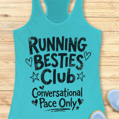 Blue tank top with 'Running Besties Club Conversational Pace Only' text on a wooden surface.