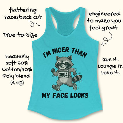Blue tank top with raccoon graphic and text I'm nicer than my face looks, on a white background