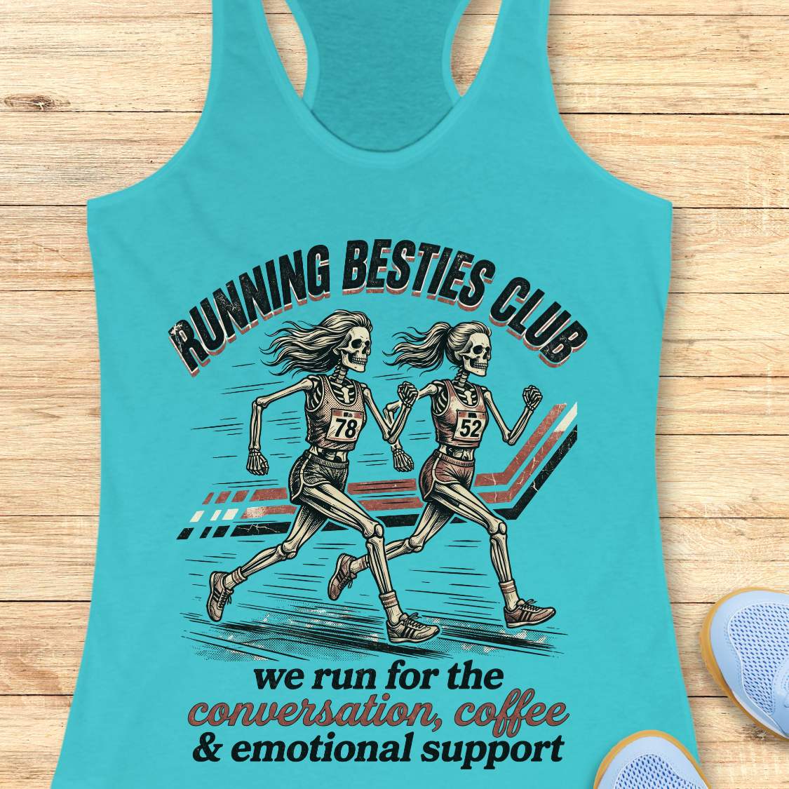 Turquoise Tank top with 'Running Besties Club' design featuring skeletons running, on a wooden surface.