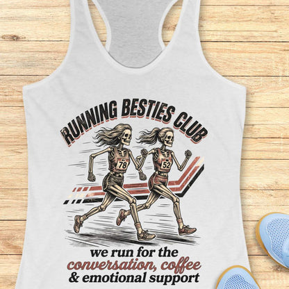 white Tank top with 'Running Besties Club' design featuring skeletons running, on a wooden surface.