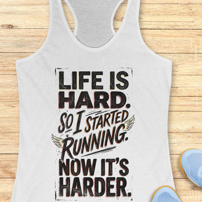 white tank top with with funny quote life is hard. So I started running. Now it's harder. on a wooden surface