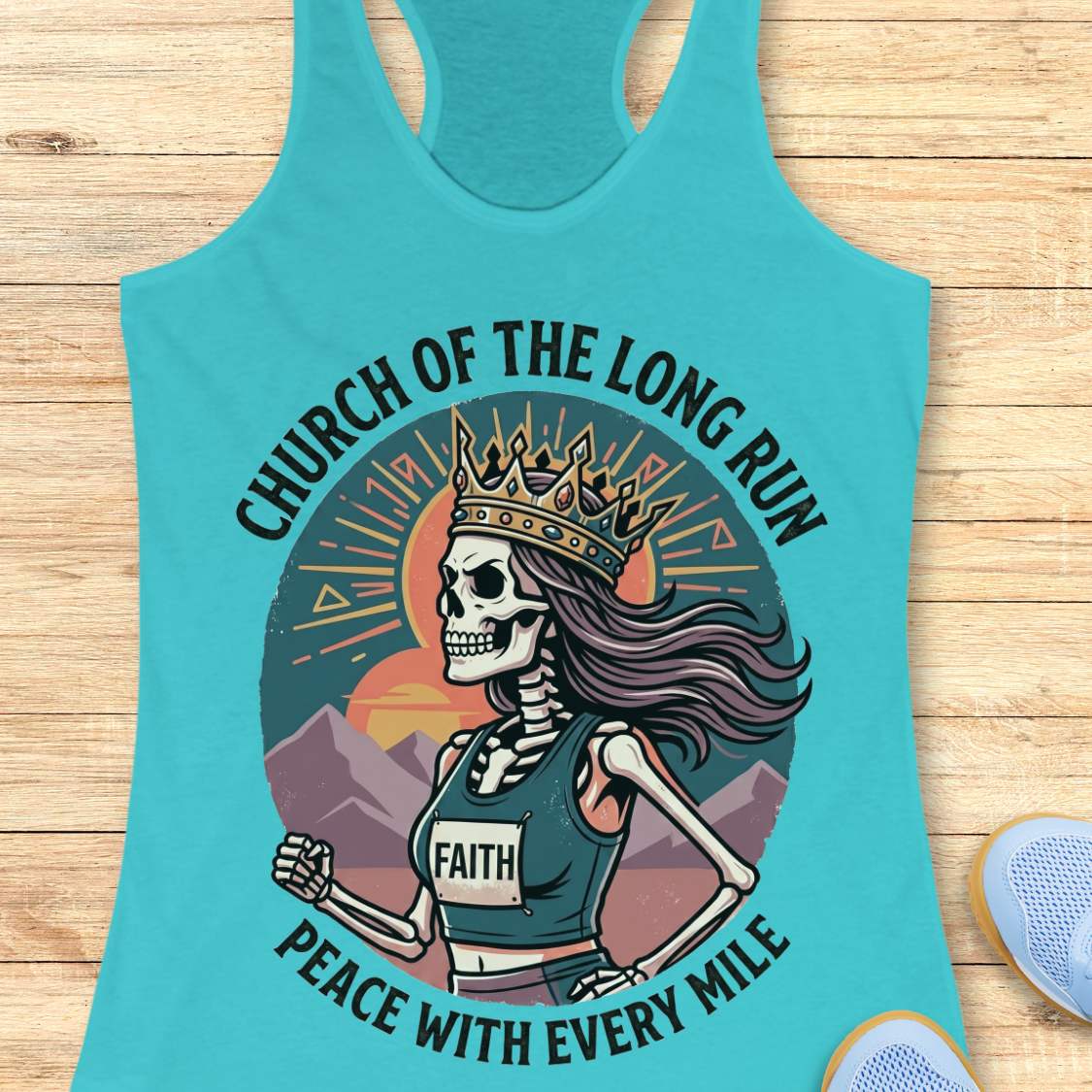 Turquoise tank top with skeleton design and text Church of the long run, peace with every mile, on a wooden surface