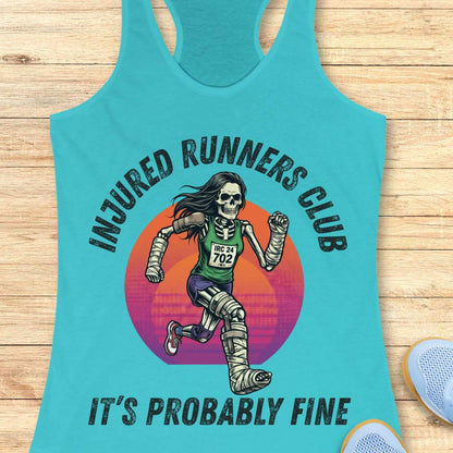 Turquoise tank top with skeleton runner graphic and text injured runners club, it's probably fine, on a wooden surface