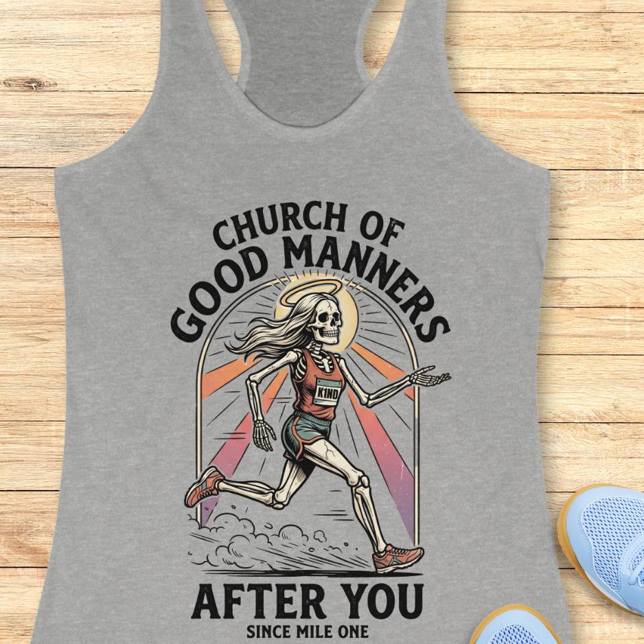 Gray tank top with skeleton design and text 'Church of Good Manners After You Since Mile One' on a wooden surface.