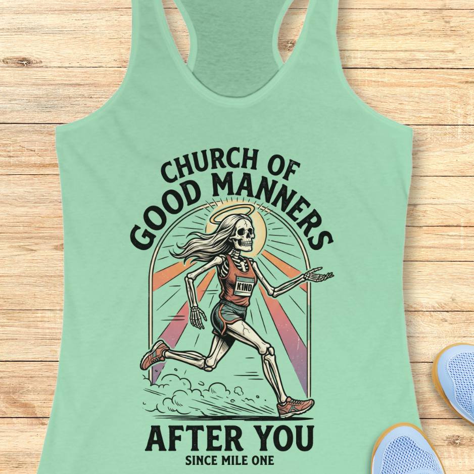 Mint green tank top with skeleton design and text 'Church of Good Manners After You Since Mile One' on a wooden surface.